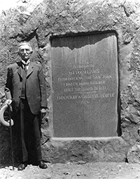 Otto posing by his honorary tablet at Bear
Creek Falls where his famous toll gate/house was during the dedication
in 1929 or 1931